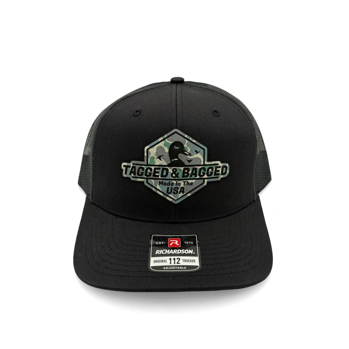 Black cap with camouflage 'Tagged & Bagged' logo