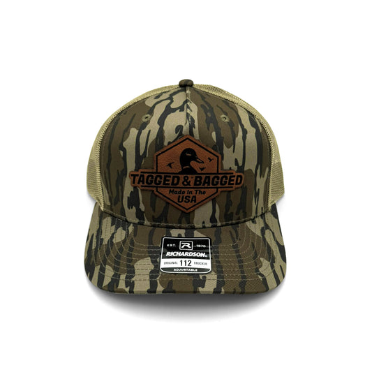 Camouflage cap with 'Tagged & Bagged' logo