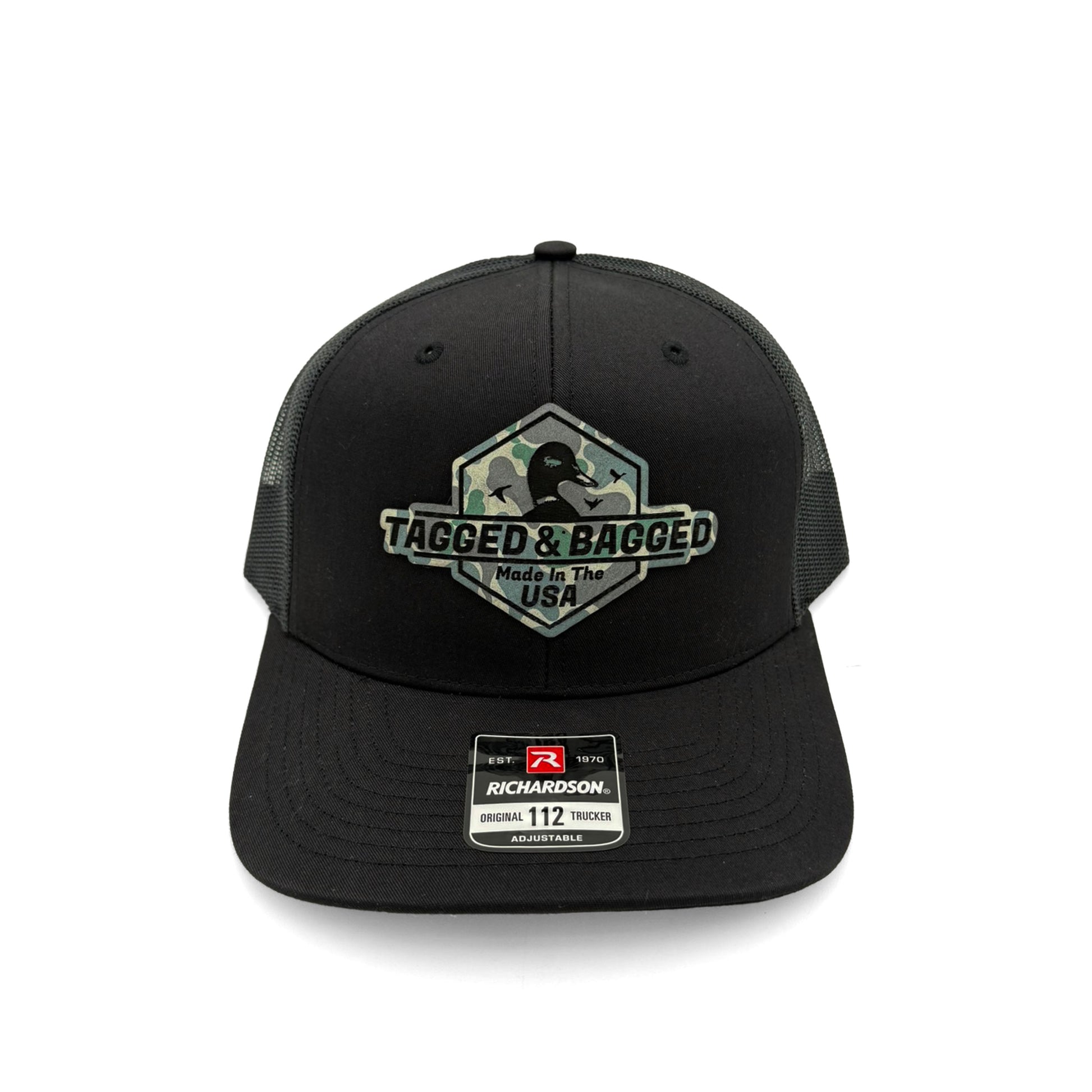 Black cap with camouflage 'Tagged & Bagged' logo
